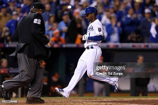 Jarrod Dyson of the Kansas City Royals scores on Billy Butler of the Kansas City Royals sacrifice fly to left field in the sixth inning to take the...