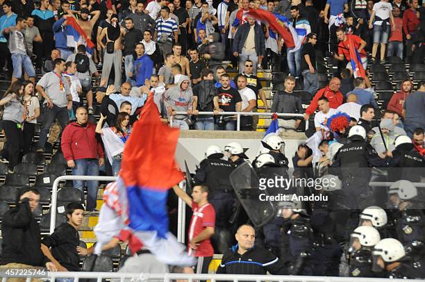 Serbian police secure supporters of Serbian national soccer players during brawl between players on the pitch during the UEFA EURO 2016 group I...