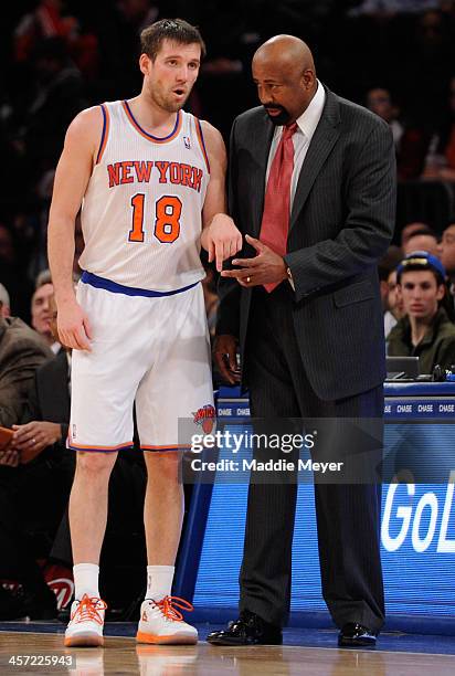 New York Knicks head coach Mike Woodson talks with Beno Udrih of the New York Knicks during the second half against the Washington Wizards at Madison...