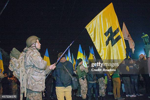 Ukrainian nationalists and servicemen of the Azov battalion demonstrate during the march marking the 72nd anniversary of the Ukrainian Insurgent Army...