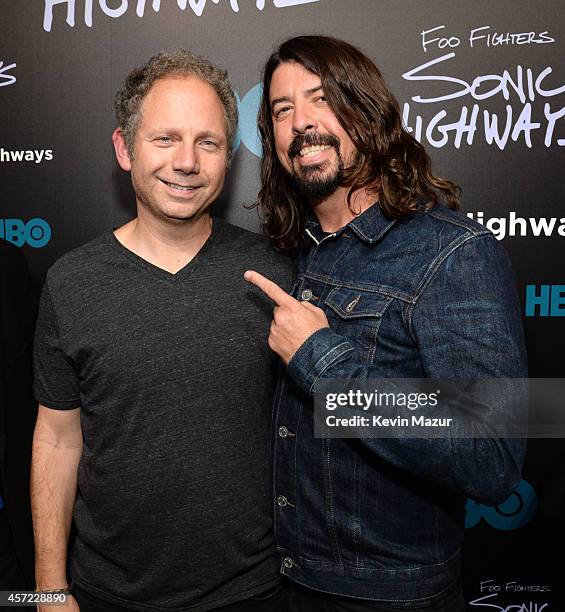 Producer Rob Burnett and Dave Grohl attend the premiere of Foo Fighters "Sonic Highways" at the Ed Sullivan Theater on October 14, 2014 in New York...