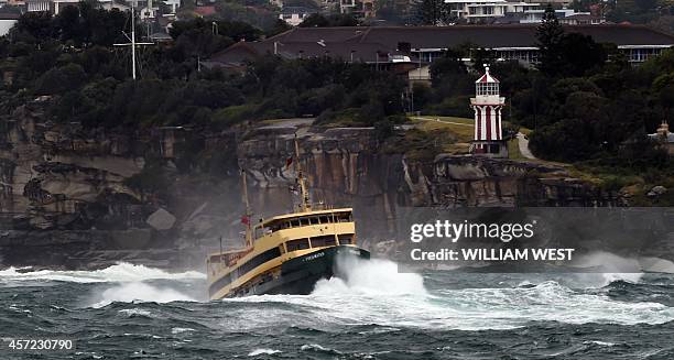 Sydney's Manly ferry ploughs through the waves after gale force winds, torrential rain and snow wreaked havoc across Sydney and surrounding areas on...