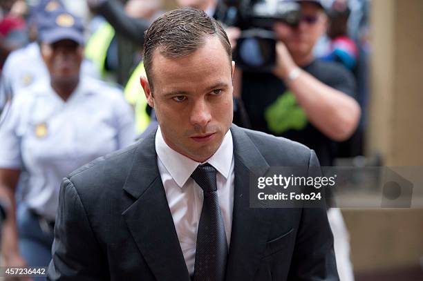 Oscar Pistorius arrives at the Pretoria High Court on October 15 in Pretoria, South Africa. Judge Thokozile Masipa found Oscar Pistorius not guilty...