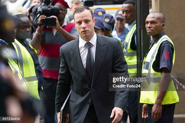 Oscar Pistorius arrives at the Pretoria High Court on October 15 in Pretoria, South Africa. Judge Thokozile Masipa found Oscar Pistorius not guilty...