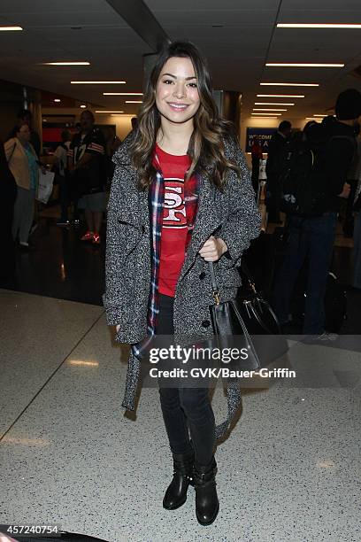 Miranda Cosgrove seen at LAX on October 14, 2014 in Los Angeles, California.