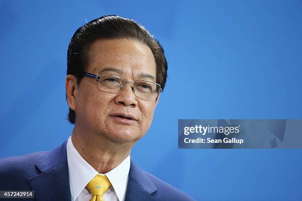 Vietnamese Prime Minister Nguyen Tan Dung speaks to the media with German Chancellor Angela Merkel following talks at the Chancellery on October 15,...