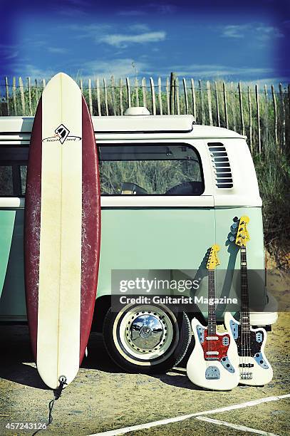 Fender Jaguar electric guitar and bass photographed with a surf board and Volkswagen Camper van for a feature on surf rock, taken on July 1, 2011.