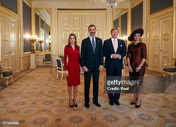 Spain's King Felipe VI and his wife Queen Letizia pose for a photo with the Netherlands' King Willem-Alexander and his wife Queen Maxima at the royal...