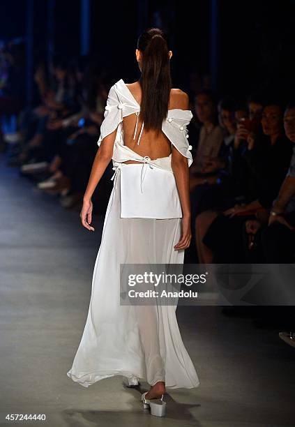 Model displays a creation by designer Selma State at the Mercedes-Benz Fashion Week Istanbul at Antrepo 3 in Istanbul, Turkey on October 15, 2014.