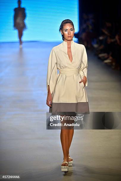 Model displays a creation by designer Selma State at the Mercedes-Benz Fashion Week Istanbul at Antrepo 3 in Istanbul, Turkey on October 15, 2014.