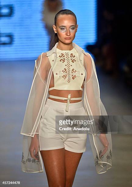 Model displays a creation by designer Selma State at the Mercedes-Benz Fashion Week Istanbul at Antrepo 3 in Istanbul, Turkey on October 15, 2014.