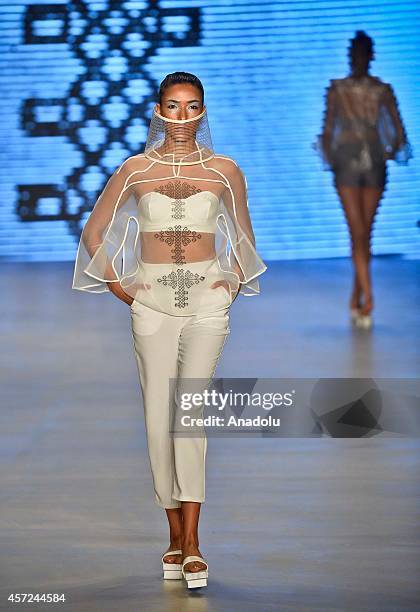 Model displays a creation by designer Selma State at the Mercedes-Benz Fashion Week Istanbul at Antrepo 3 in Istanbul, Turkey on October 15, 2014.