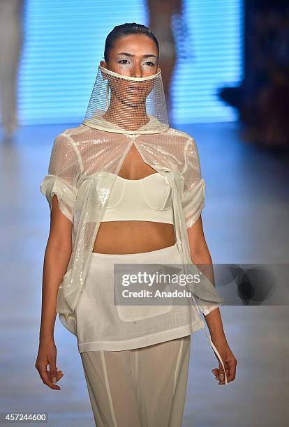 Model displays a creation by designer Selma State at the Mercedes-Benz Fashion Week Istanbul at Antrepo 3 in Istanbul, Turkey on October 15, 2014.