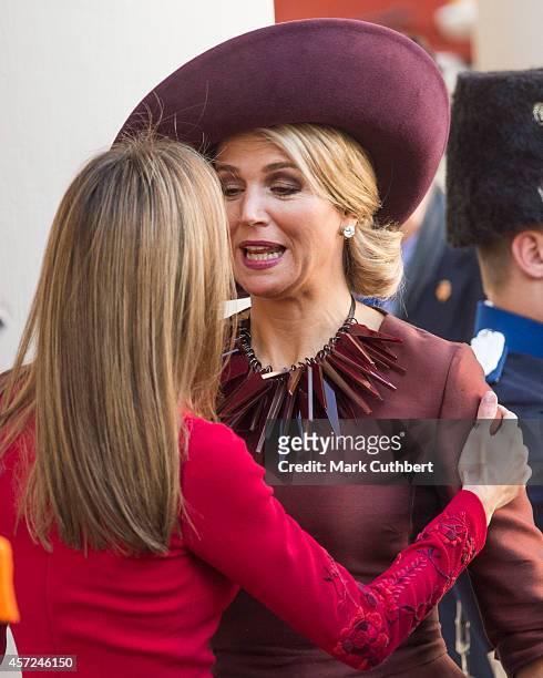 Queen Maxima of the Netherlands and Queen Letizia of Spain at The Noordeinde Palace on October 15, 2014 in The Hague, Netherlands.