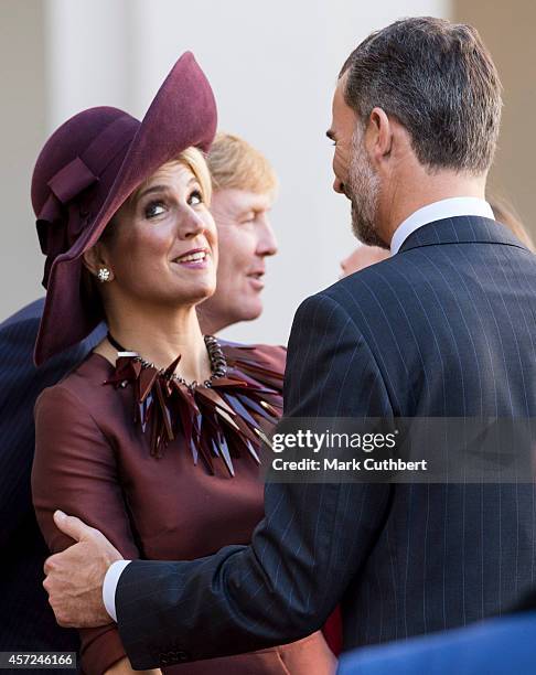 Queen Maxima of the Netherlands with King Felipe of Spain at The Noordeinde Palace on October 15, 2014 in The Hague, Netherlands.