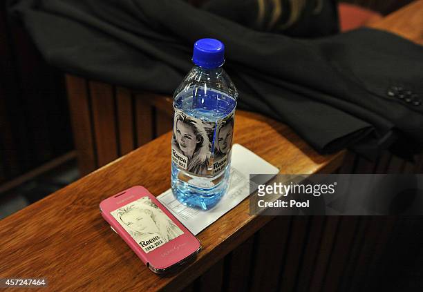 Bottled water with the face of Reeva Steenkamp on is seen in the Pretoria High Court on October 15 in Pretoria, South Africa. Judge Thokozile Masipa...