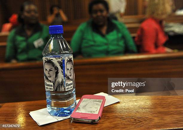 Bottled water with the face of Reeva Steenkamp on is seen in the Pretoria High Court on October 15 in Pretoria, South Africa. Judge Thokozile Masipa...