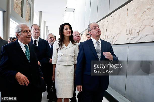 Amal Alamuddin Clooney is guided by minister of Culture and Sports Konstantinos Tasoulas and president of the Acropolis museum Dimitris Pantermalis...