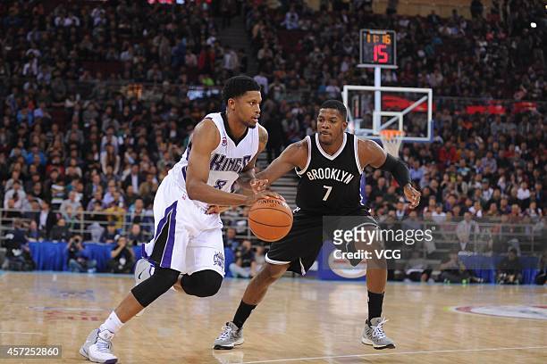 Rudy Gay of the Sacramento Kings drives the ball against Joe Johnson of the Brooklyn Nets during the game between the Brooklyn Nets and the...