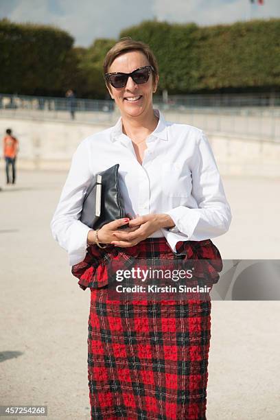 Fashion Director at Elle UK Anne-Marie Curtis is wearing a Simone Rochas skirt, Made in Heaven top, Prada bag and Karen Walker sunglasses on day 8 of...