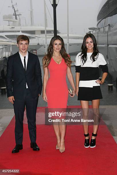 William Moseley, Elisabeth Hurley and Alexandra Park pose during 'The Royals' photocall at Mipcom 2014 on October 13, 2014 in Cannes, France.