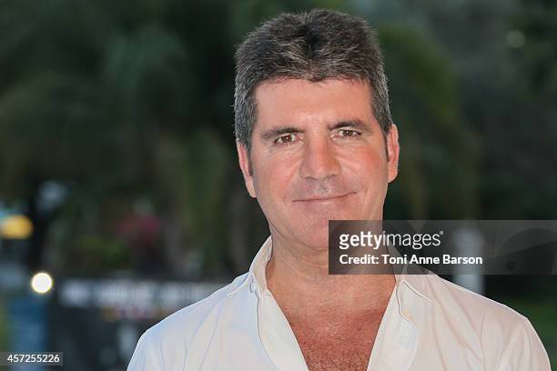 Simon Cowell - MIPCOM Personality of the Year poses during a photocall at Mipcom 2014 on October 13, 2014 in Cannes, France.