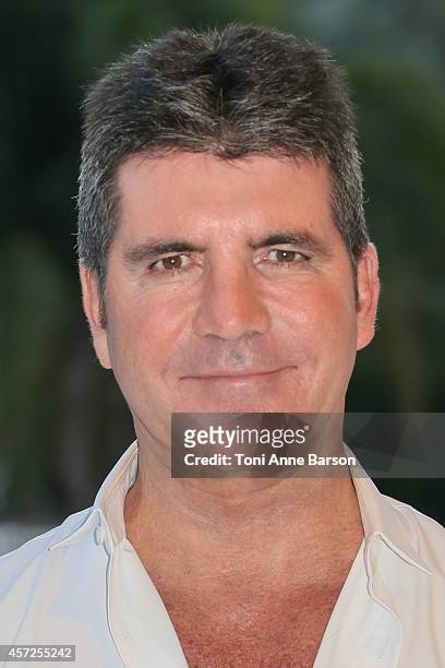 Simon Cowell - MIPCOM Personality of the Year poses during a photocall at Mipcom 2014 on October 13, 2014 in Cannes, France.