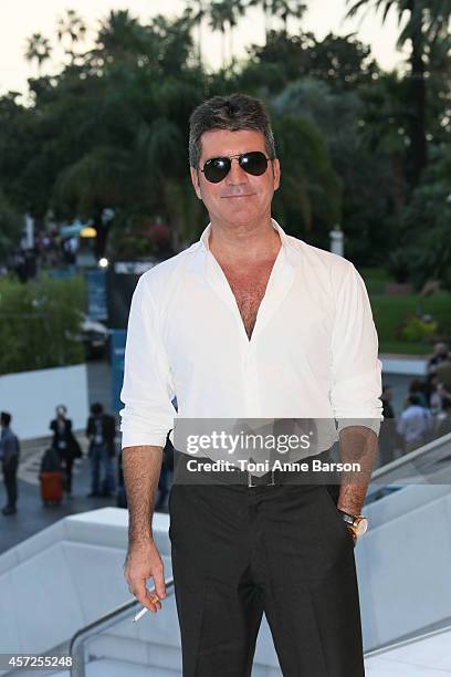 Simon Cowell - MIPCOM Personality of the Year poses during a photocall at Mipcom 2014 on October 13, 2014 in Cannes, France.