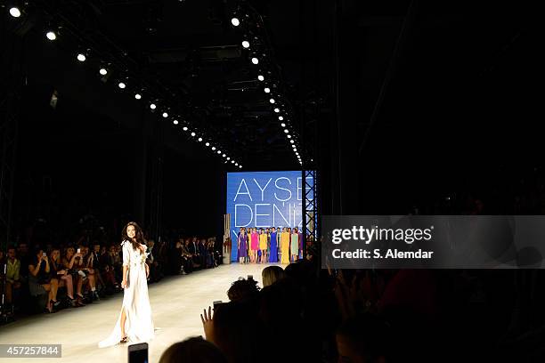 Model Ebru Salli walks the runway at the Ayse Deniz Yegin show during Mercedes Benz Fashion Week Istanbul SS15 at Antrepo 3 on October 15, 2014 in...