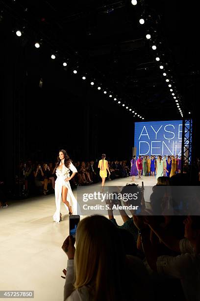 Model Ebru Salli walks the runway at the Ayse Deniz Yegin show during Mercedes Benz Fashion Week Istanbul SS15 at Antrepo 3 on October 15, 2014 in...