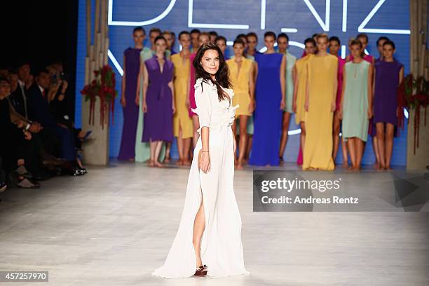 Model Ebru Salli walks the runway at the Ayse Deniz Yegin show during Mercedes Benz Fashion Week Istanbul SS15 at Antrepo 3 on October 15, 2014 in...