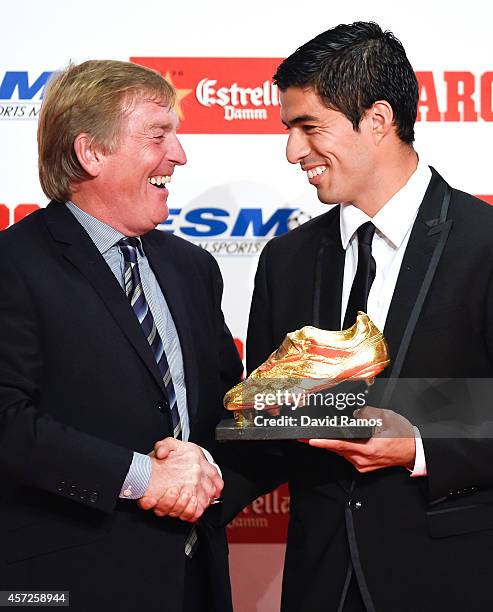 Kenny Dalglish presents the Golden Boot Trophy to Luis Suarez as the best goal scorer in all European Leagues last season on October 15, 2014 in...