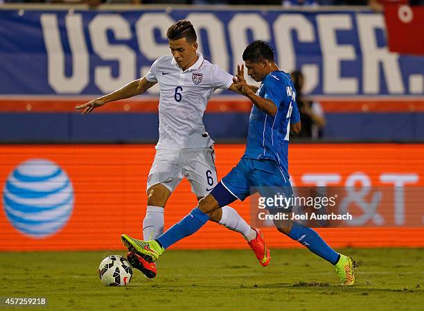 Alfredo Morales of the USA and Edder Delgado of Honduras battle along the sideline for control of the ball during an International Friendly match on...
