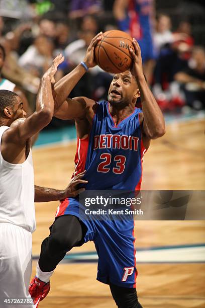 Josh Bostic of the Detroit Pistons shoots against the Charlotte Hornets during the game at the Time Warner Cable Arena on October 15, 2014 in...