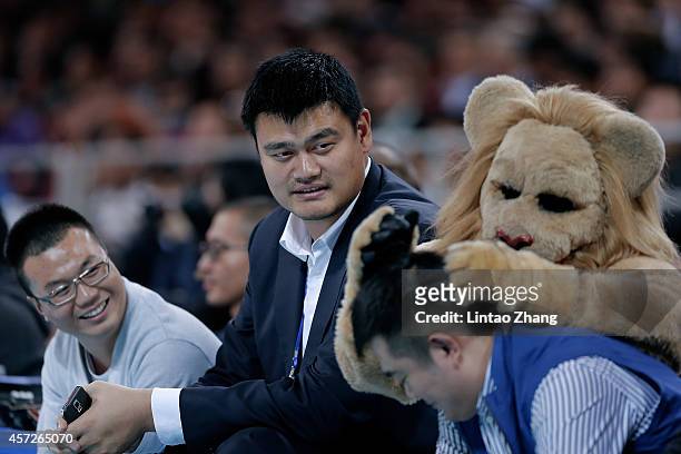 Yao Ming former NBA basketball star looks on during the 2014 NBA Global Games match between the Brooklyn Nets and Sacramento Kings at MasterCard...