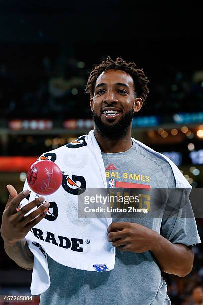 Derrick Williams of Sacramento Kings throws out a ball to the fans after the game against the Brooklyn Nets during the 2014 NBA Global Games match...
