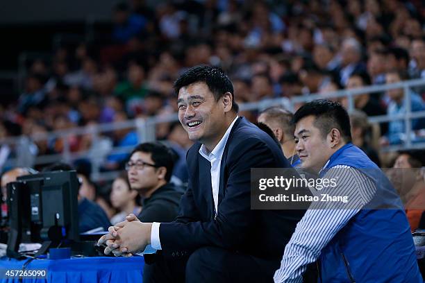 Yao Ming former NBA basketball star looks on during the 2014 NBA Global Games match between the Brooklyn Nets and Sacramento Kings at MasterCard...