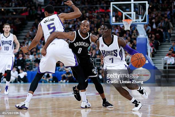 Darren Collison of Sacramento Kings drives against Jarret Jack of Brooklyn Nets during the 2014 NBA Global Games match between the Brooklyn Nets and...
