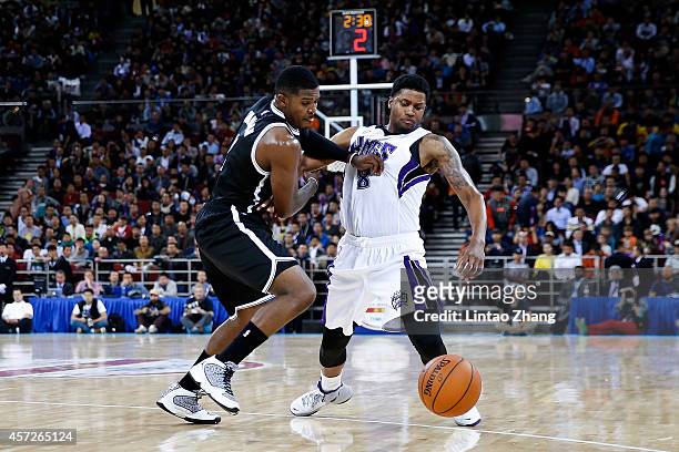 Rudy Gay of Sacramento Kings drives against Joe Johnson of Brooklyn Nets during the 2014 NBA Global Games match between the Brooklyn Nets and...