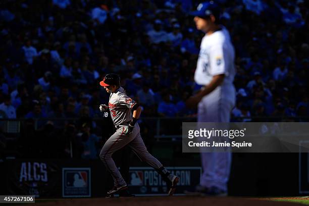 Ryan Flaherty of the Baltimore Orioles runs the bases after hitting a solo home run to right field against Jason Vargas of the Kansas City Royals in...