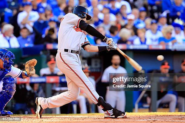 Ryan Flaherty of the Baltimore Orioles hits a solo home run to right field against Jason Vargas of the Kansas City Royals in the third inning during...