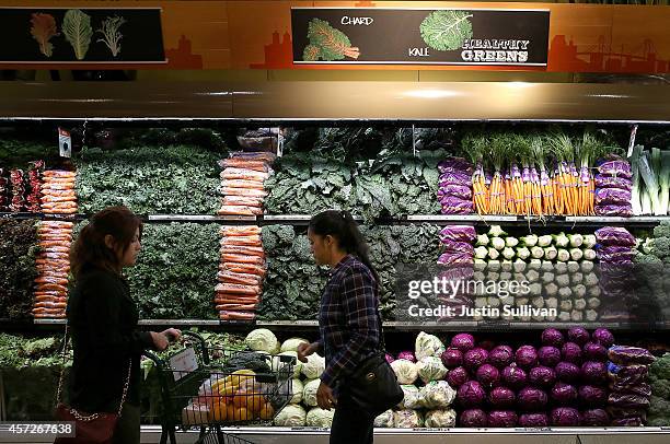 Customers shop for produce at a Whole Foods market on October 15, 2014 in San Francisco, California. Upscale grocery chain Whole Foods Market...