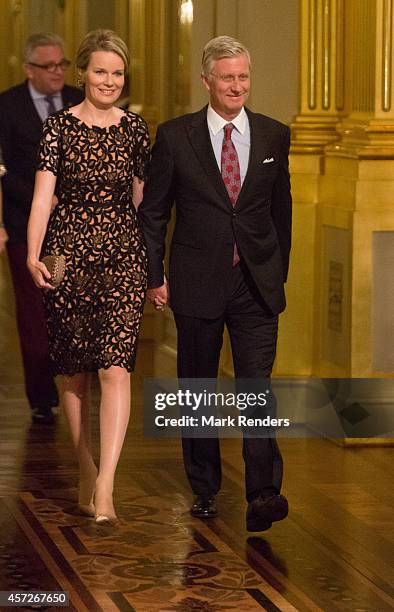 Queen Mathilde and King Philippe of Belgium assist the Autumn Concert at the Royal Palace on October 15, 2014 in Brussels, Belgium.