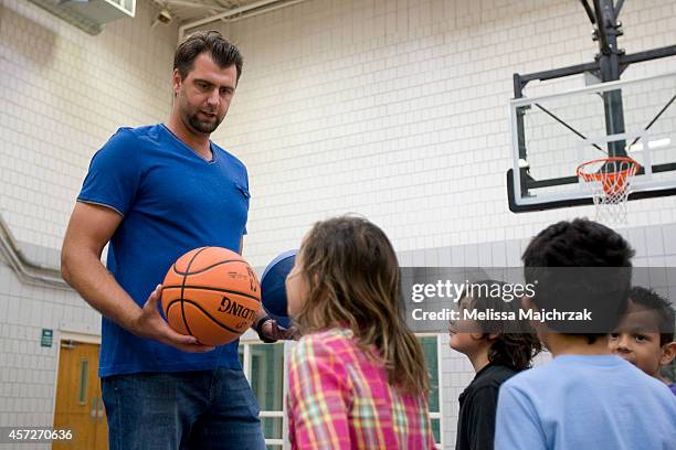 Enes Kanter of the Utah Jazz and former Jazz player Mehmet Okur visit Sorenson Multicultural Center to hand out tickets to the Jazz season opener...