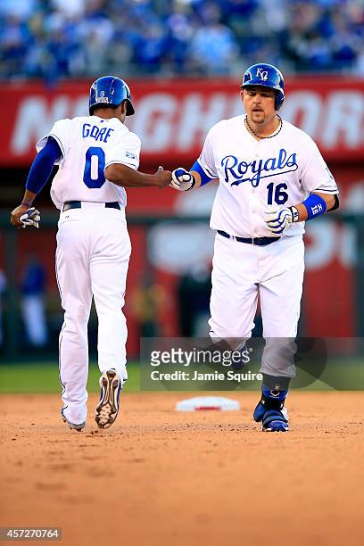 Billy Butler of the Kansas City Royals celebrates with runner Terrance Gore after hitting a double to left center field in the eighth inning against...