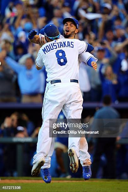 Eric Hosmer and Mike Moustakas of the Kansas City Royals celebrate their 2 to 1 win over the Baltimore Orioles to sweep the series in Game Four of...