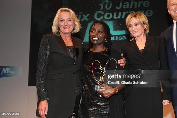 Sibylle Bassler, Mona Lisa, Patricia Kaas, Auma Obama, founder 'Sauti Kuu' , attend the Prix Courage Award 2014 on October 15, 2014 at...