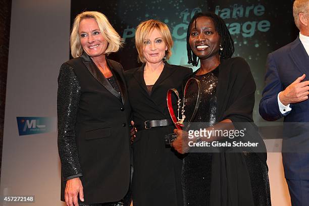 Sibylle Bassler, Mona Lisa, Patricia Kaas, Auma Obama, founder 'Sauti Kuu' attend the Prix Courage Award 2014 on October 15, 2014 at...