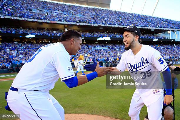 Eric Hosmer and Salvador Perez of the Kansas City Royals celebrate their 2 to 1 win over the Baltimore Orioles to sweep the series in Game Four of...