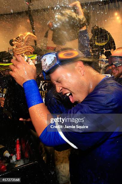 Salvador Perez of the Kansas City Royals celebrate in the locker room after their 2 to 1 win over the Baltimore Orioles to sweep the series in Game...